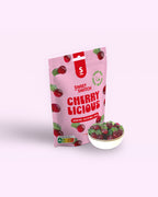 Pink package of 'Sweet Switch Cherry Licious' with a bowl of gummy cherries on a white background sugar free