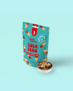 Sweet Switch Cola Zero packaging with a bowl of cola on a light blue  sugar freebackground