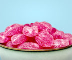 Pink lips on a plate with a light blue background sugar free
