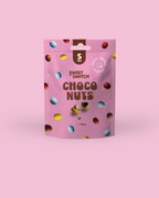 Pink packaging of Sweet Switch Choco Nuts on a pink background sugar free