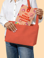 Person holding a red tote bag with a 'Sweet Switch Peach Pleasure' package on a beige background sugar free