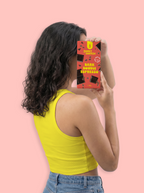 Person holding a box of Sweet Switch chocolate against a pink background sugar free