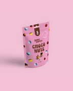 Pink packaging of Sweet Switch Choco Nuts on a pink background sugar free
