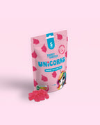 Pink package of 'Sweet Switch Unicorns' gummys on a light pink background sugar free