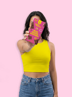 Person holding a pink chocolate bar with a pink background sugar free